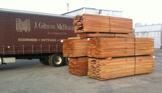 cherry lumber stacks beside mcilvain truck