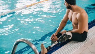 man with prosthetic leg at pool