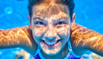 underwater girl smiling in pool