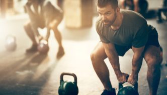 man working on muscle strengthening exercises