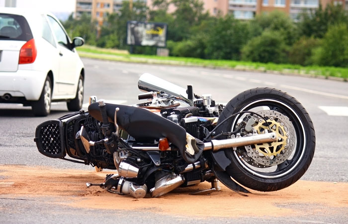 motorcycle accident lying on highway