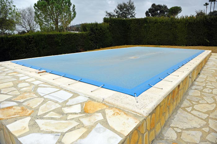 swimming pool protected with tight sturdy cover