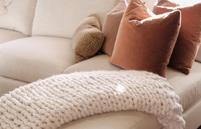 blanket draped over sofa at Willow Furniture